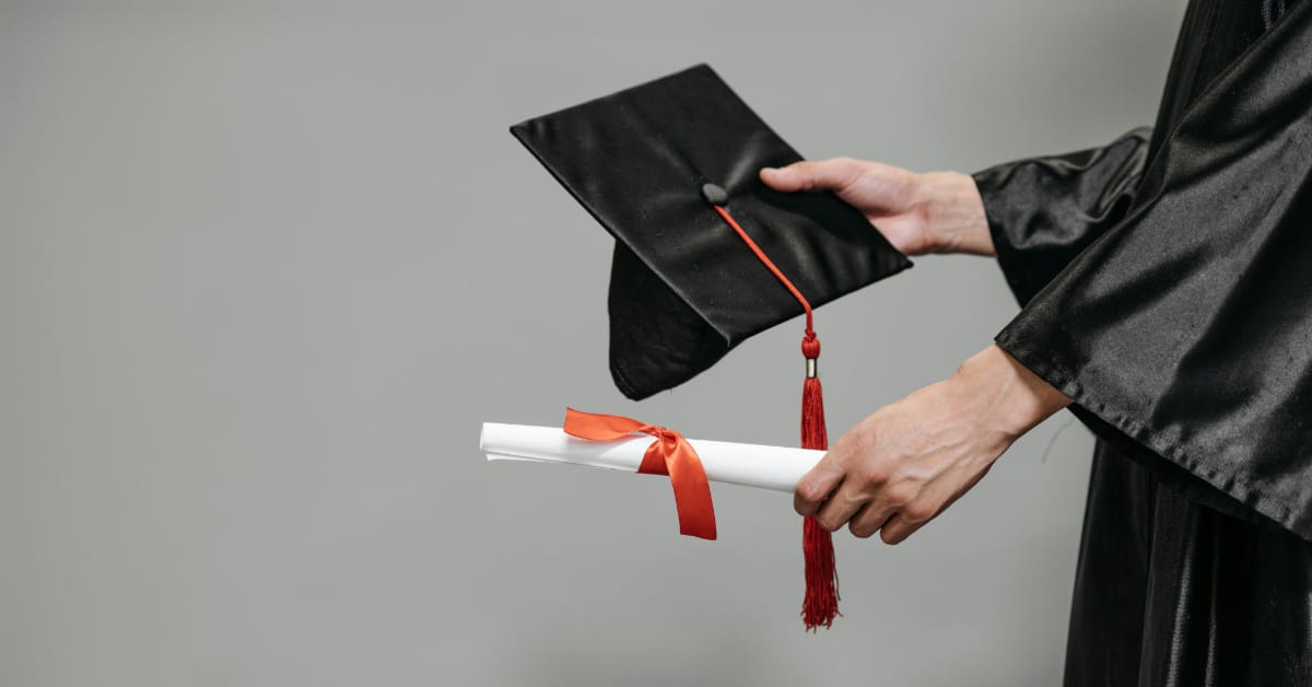 Best medical school pakistan Person holding a graduation cap and diploma