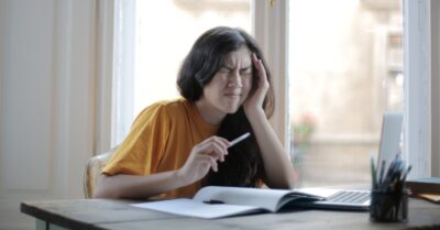 Stressed nursing student at her desk