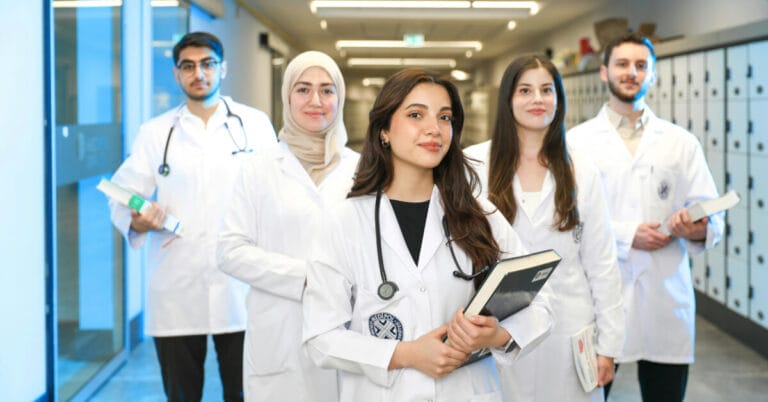 5 medical students standing next to each other
