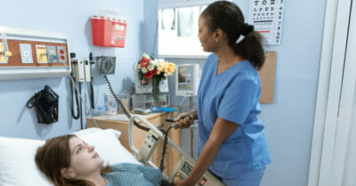 Nurse treating patient