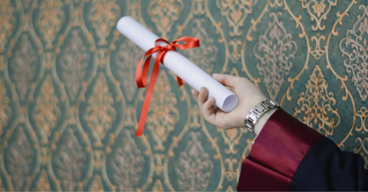 Person holding a diploma