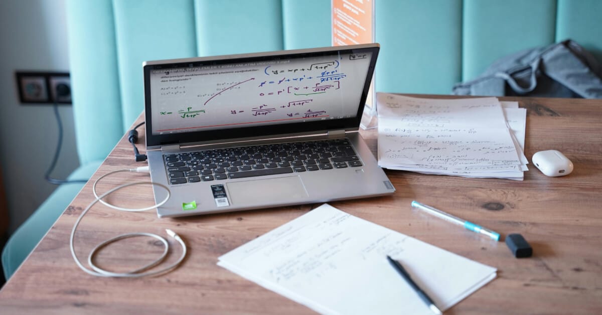 Desk with laptop and study materials