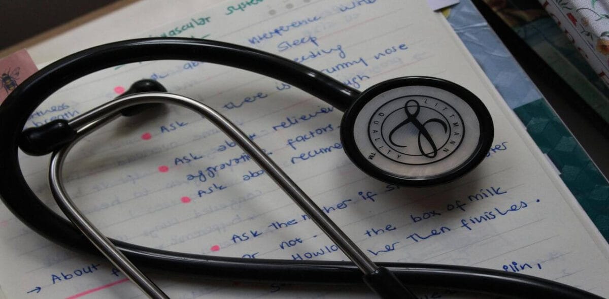 A stethoscope on a notebook