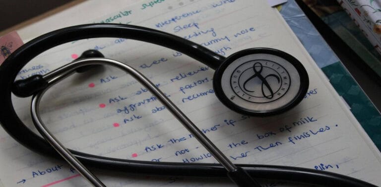 A stethoscope on a notebook