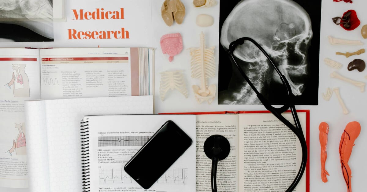 A desk full of medical study materials